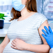 Photo of pregnant woman receiving a vaccine