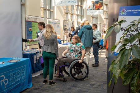 Attendees from Rare Disease Day at NIH 2020 converse in the exhibit area.