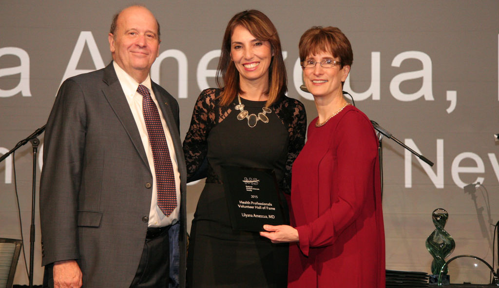 Lilyana Amezcua, center, receives an award, with Eli Rubenstein and Cynthia Zagieboylo.
