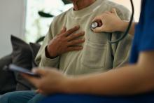 Doctor checks patient’s heart.